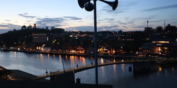 Warning systems in the foreground, and a city in the background.